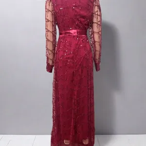 Back view of burgundy mesh sequin evening gown showing intricate glitter patterns