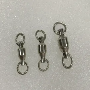 Detail view of three different sizes of stainless steel swivels for parrot foot rings