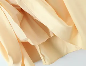 Close-up detail of the smooth inner lining and neat stitching of a summer formal dress