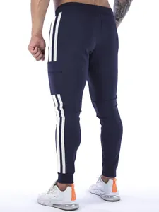 Back view of navy blue men's sports sweatpants with white side stripes and pockets