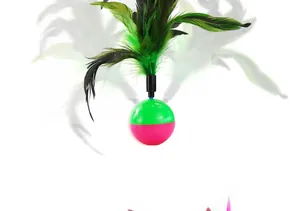 Close-up of interactive cat tumbler toy featuring vibrant green and black feathers