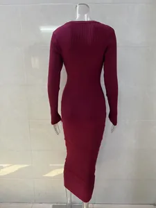 Detailed back view of a long-sleeve burgundy ribbed knit dress on a mannequin for women