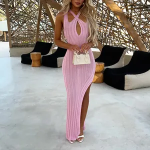 Elegant pink ribbed knit bodycon maxi dress featuring a halter cross neck and side slit