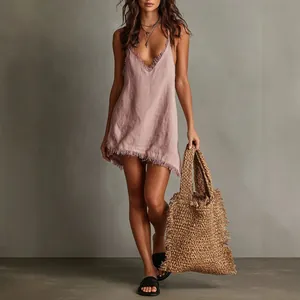 Elegant pink V-neck mini dress with frayed hem and spaghetti straps for summer resort wear