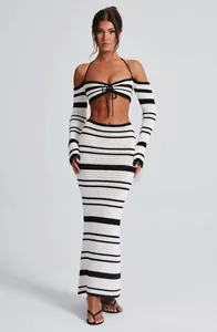 Elegant black and white striped crochet two-piece set with halter top and maxi skirt