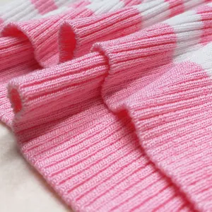 Detailed close-up showing the soft pink and white striped ribbed knit fabric texture.