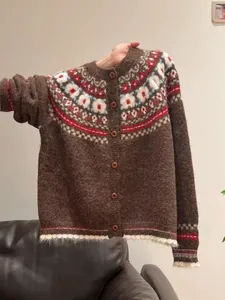 Detail view of brown Fair Isle knit cardigan with vintage pattern and fuzzy texture