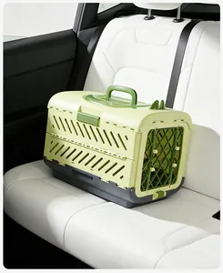 Foldable green pet travel carrier placed on a white car seat for safe animal travel