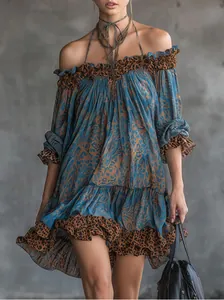 Detailed view of an elegant retro blue mini dress with chic leopard print trim.
