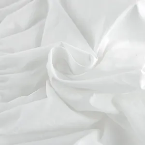 Detailed macro view showing the soft white cotton fabric texture of the summer bandeau top.