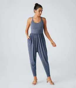 Full-body view of a women's blue heathered sleeveless jumpsuit with pockets