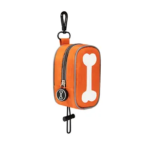 Distributeur de sacs à déjections canines orange avec motif d'os et clip de transport