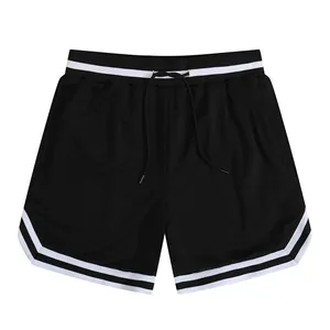 Macro view of black mesh athletic shorts with white striped cuffs and drawstring