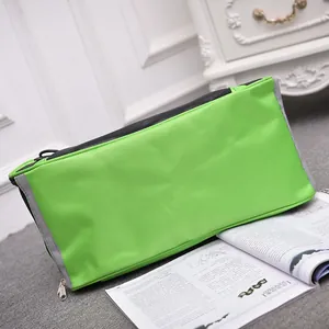 Durable green breathable pet carrier bag for small cats and dogs in a home setting
