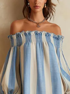 Detail of blue and white striped off-the-shoulder dress with ruffled neckline