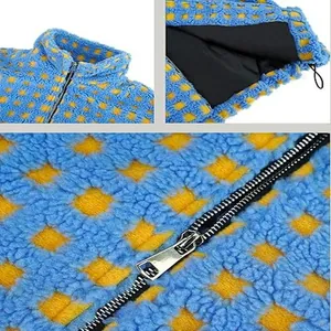 Detail view of blue and yellow checkered lamb wool jacket showing zipper and texture.