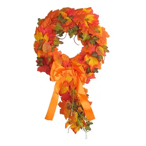 Autumn maple leaf teardrop wreath with large orange bow for harvest festival decor