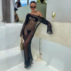 Black sheer knit long sleeve maxi dress cover-up, perfect for a stylish beach vacation.