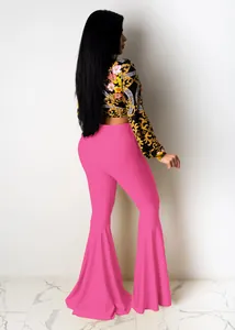 Rear detail view of sexy slim fit pink bell-bottom pants with ruffled hem and floral top