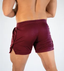 Back view detail of men's maroon mesh athletic shorts for gym training and running.