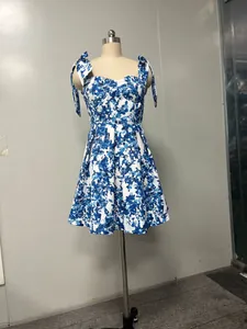 View of an elegant floral off-shoulder organza short dress on a mannequin stand