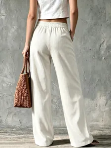 Back view of women's vintage cream corduroy wide-leg trousers with high waist