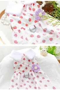 Close-up detail of cute strawberry print pet dress with purple flower and D-ring
