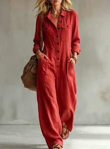 Detailed view of a red linen utility jumpsuit with lapel collar and wide leg design