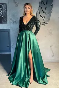 Front view of an emerald green evening dress featuring a sequined bodice and satin skirt