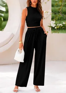 Model wearing black sleeveless knit tank top and matching wide-leg drawstring trousers.