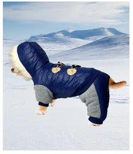 Detail view of the warm blue dog winter coat featuring classic toggle buttons and a fur hood.