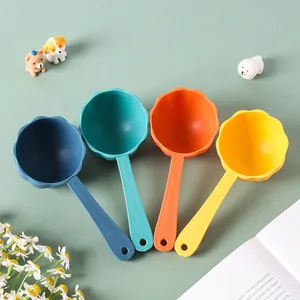 Set of four colorful flower-shaped plastic pet food scoops for dogs and cats feeding