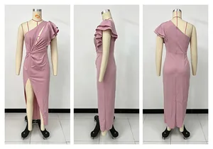 Detail view of a pink one-shoulder formal dress with ruffles and high slit on a mannequin.