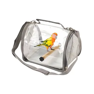 Detailed view of transparent bird travel bag showing mesh ventilation and wooden perch