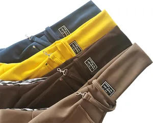 Detailed view of solid color pet sling carriers in navy, yellow, brown, and taupe.