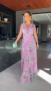 Elegant lavender floral print chiffon maxi dress shown on a model in a modern interior.