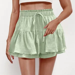 Detail shot of women's sage green tiered ruffle skort with adjustable drawstring waist