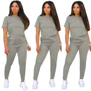 Front view of solid grey two-piece set featuring round neck T-shirt and leggings