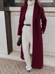 Elegant long burgundy wool coat for women with a minimalist winter streetwear aesthetic.