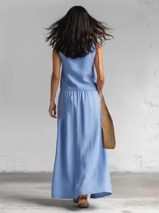 Back view of a light blue sleeveless cotton linen top and matching maxi skirt set