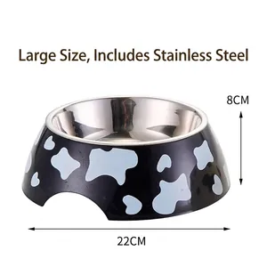 Detailed macro view showing the 22cm diameter and cow pattern of this stainless steel pet bowl