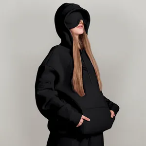 Black oversized street style hoodie with unique built-in eye mask and sleeve pocket