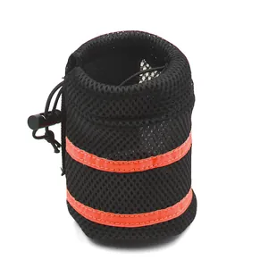 Macro view of black mesh pet accessory pouch with two orange reflective stripes
