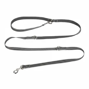 Detail of gray multi-functional hands-free dog leash with adjustable metal rings and strap.