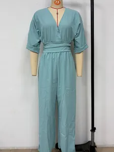 Front view of an elegant light blue V-neck jumpsuit with a high-waisted belt
