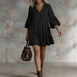 Elegant black tiered mini dress with bell sleeves for summer vacation styling