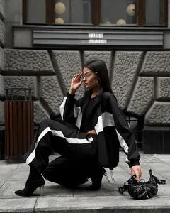 Trendy black and white color-block tracksuit set with zipper jacket and loose pants