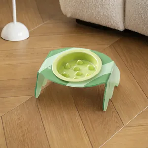Eco-friendly green slow feeder pet bowl with stylish tilted acrylic stand for cats and dogs