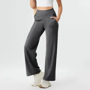 Detailed view of high-waisted straight-leg yoga pants in charcoal grey with side pockets