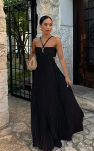 Elegant black pleated maxi dress with a sophisticated halter neckline and cutout details.